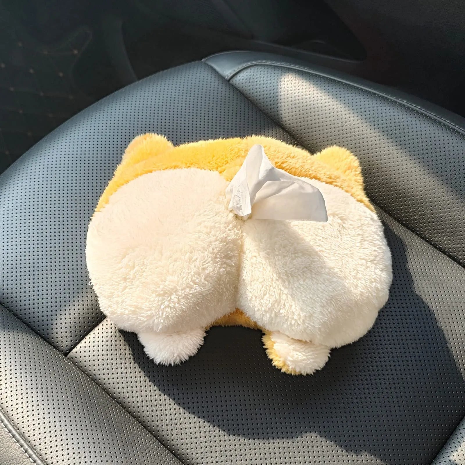Yellow soft plush corgi butt shaped car tissue holder with elastic hanging straps.