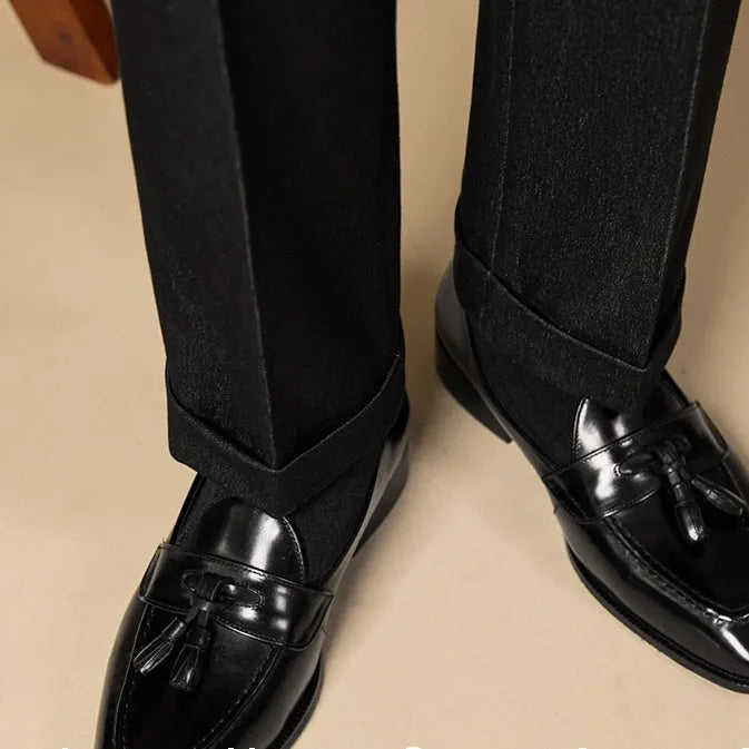 Men's black genuine leather tassel loafers with a rubber sole