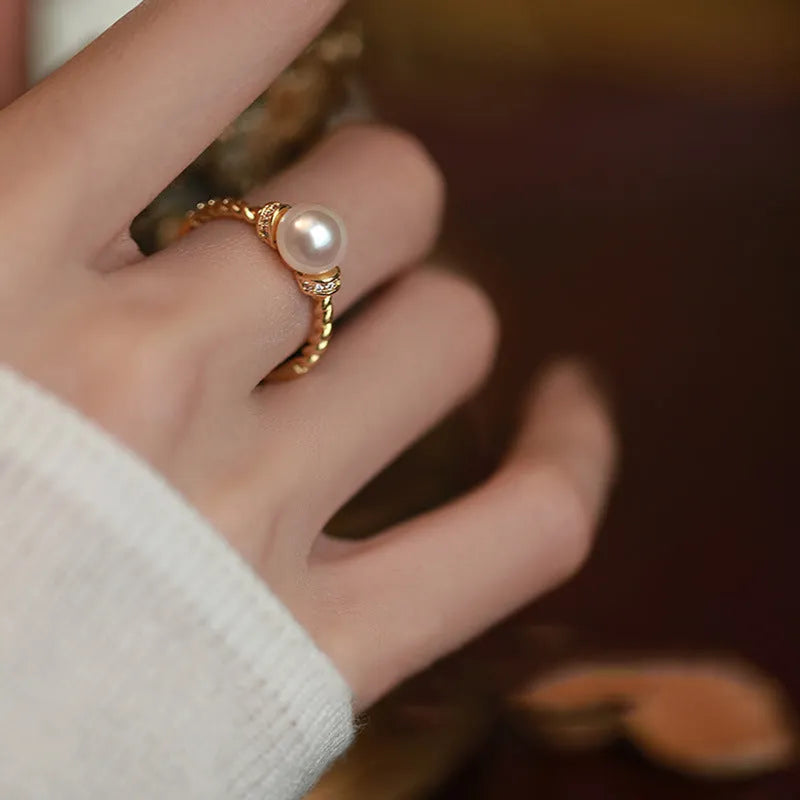Adjustable copper ring with antique twist design and pearl inlay detail