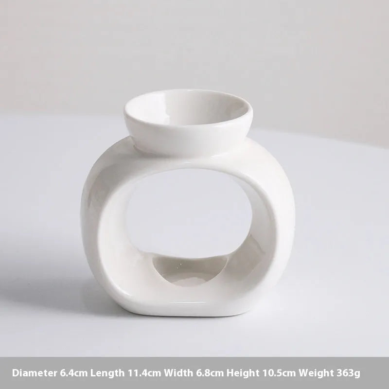 White ceramic Nordic style aromatherapy stove ornament measuring 10cm diameter