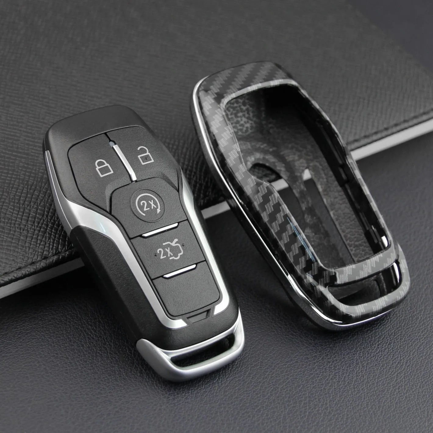 Plastic protective shell for a car key remote, shown in two colour variations