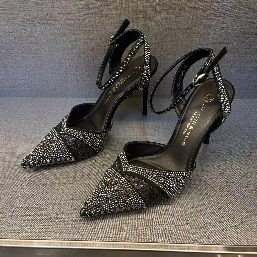 Women's black hollow high heels with red sole, stiletto heel and pointed toe design