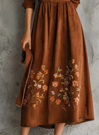 Brown vintage floral embroidered suede-look midi dress on mannequin