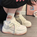 Women's green patent leather platform sneaker with front lace-up design and round toe