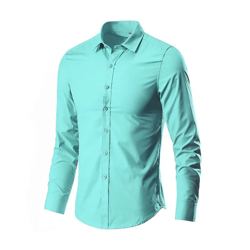 Man wearing a loose fit long-sleeve linen shirt in a neutral colour, showcasing the casual silhouette.
