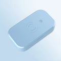 White ultraviolet disinfection box with wireless charging pad inside for phones and beauty tools.