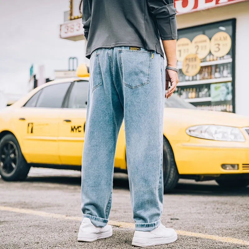 Men's loose straight casual jeans in dark blue, light blue and grey colours with mid waist design