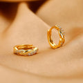 Interwoven hemp rope earrings with geometrical round shape in gold and silver colours