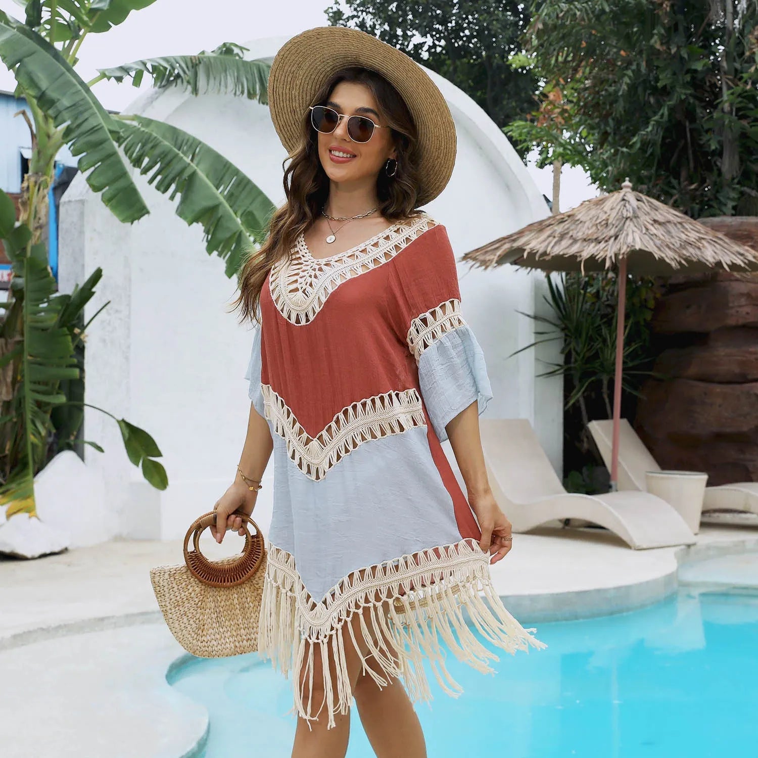 Orange hand crochet beach overskirt with floral pattern and tassel trim
