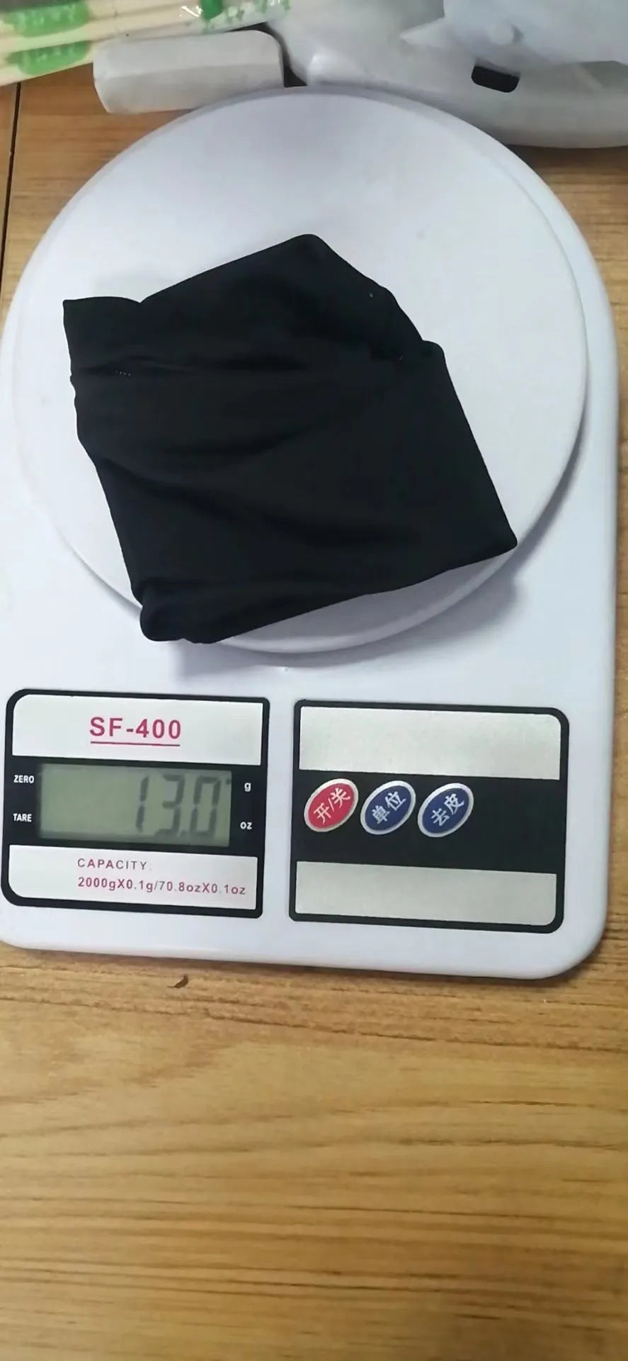Wrist bag armband sleeve for mobile phone, shown in packaging, dimensions 10 by 10.5 cm.