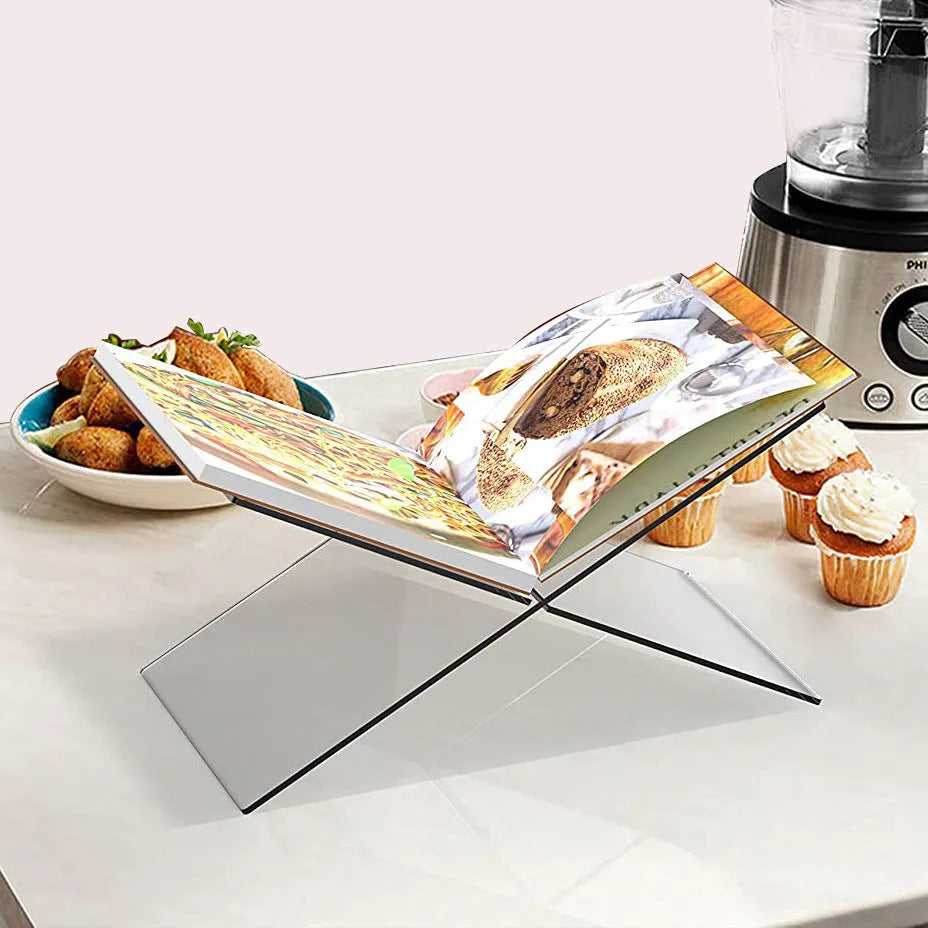 Clear acrylic X-type book reading rack displaying books upright on desktop