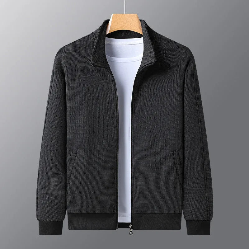 Men's black stand-up collar zip-front jacket in an athletic fit on a hanger.