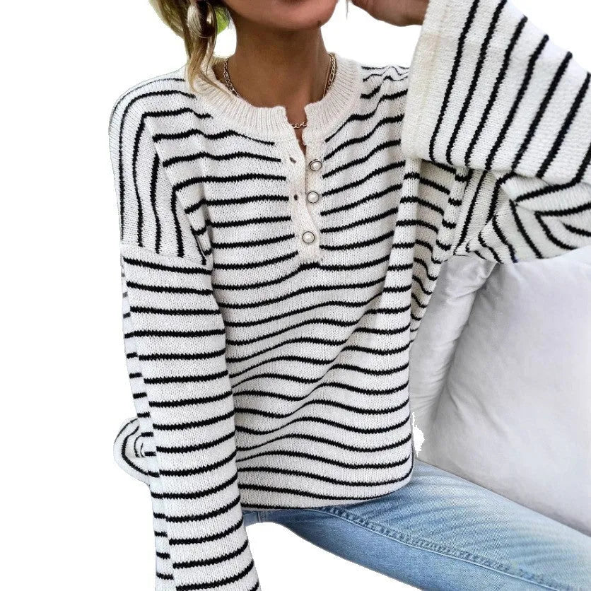 Black striped women's loose top with drop shoulders and button detail on viscose knit fabric
