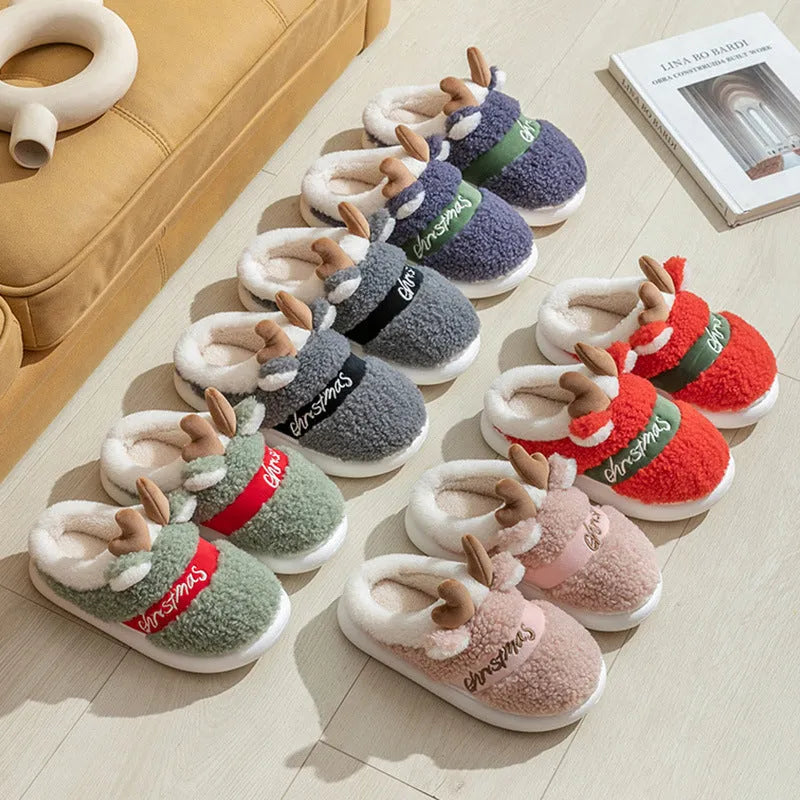 Pair of Christmas elk winter home slippers with suede upper, available in candy colours