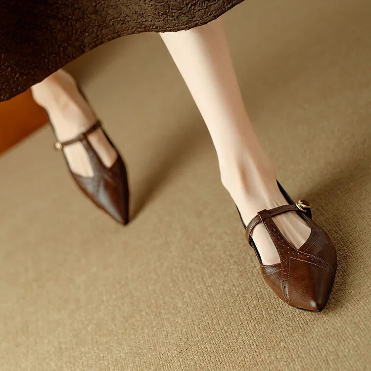Brown women's low-cut cowhide leather flat shoes with round toe and soft sole on a white background.