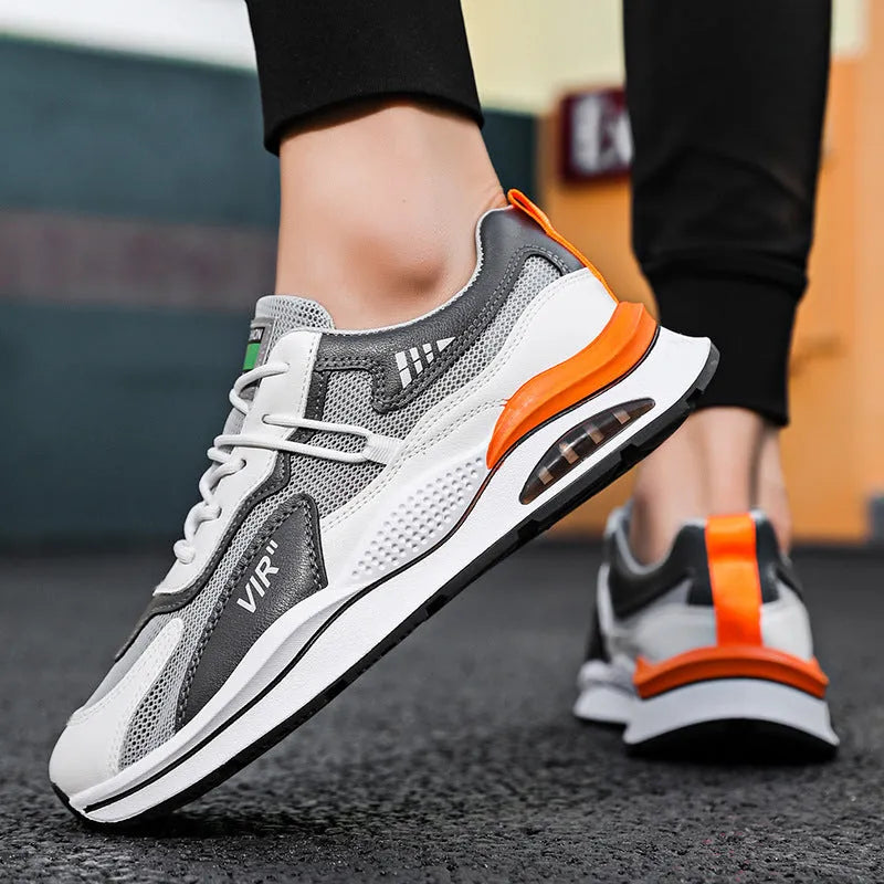 Men's gray breathable mesh running shoes with a round toe and casual sewing thread details on a white background.