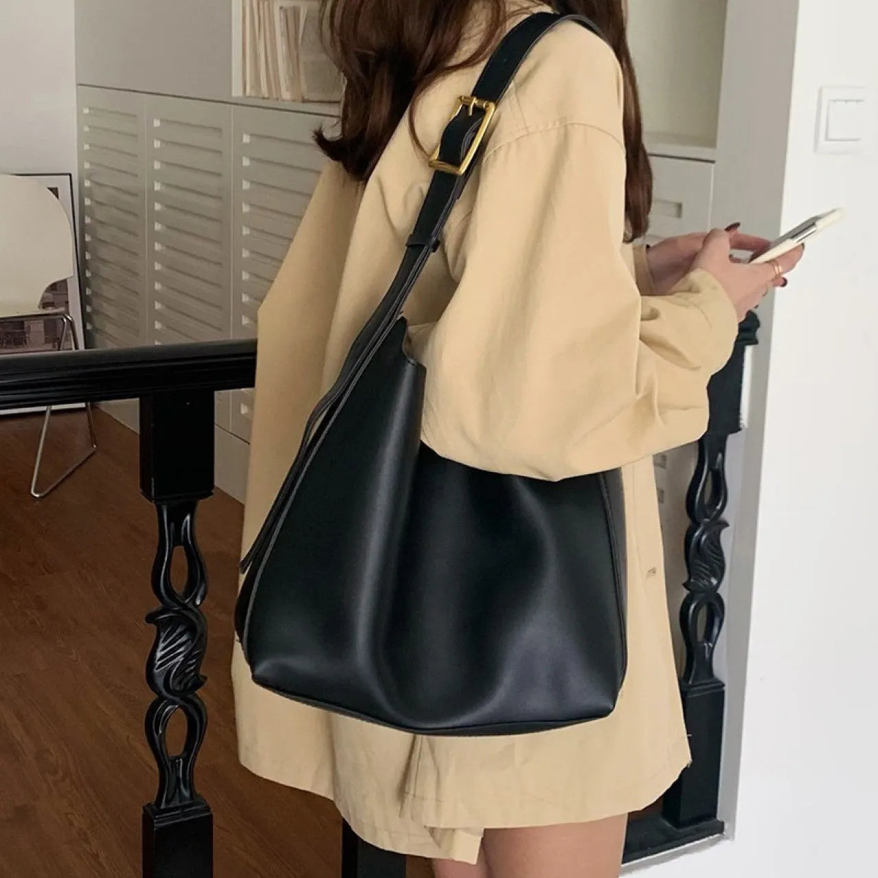 Women's soft PU leather shoulder bag with swing thread detailing in black or brown colour options