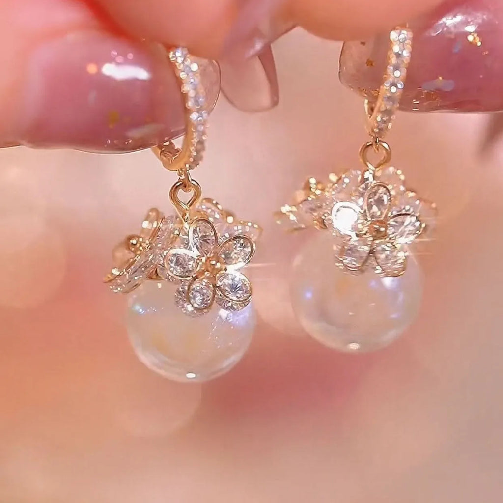 Geometric rose detail zircon earrings for women in copper, available in multiple colours.