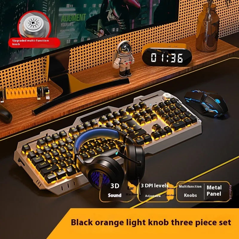 Aluminium gaming keyboard with volume knob, shown in metal grey with RGB lighting alongside optional macro mouse and headset.