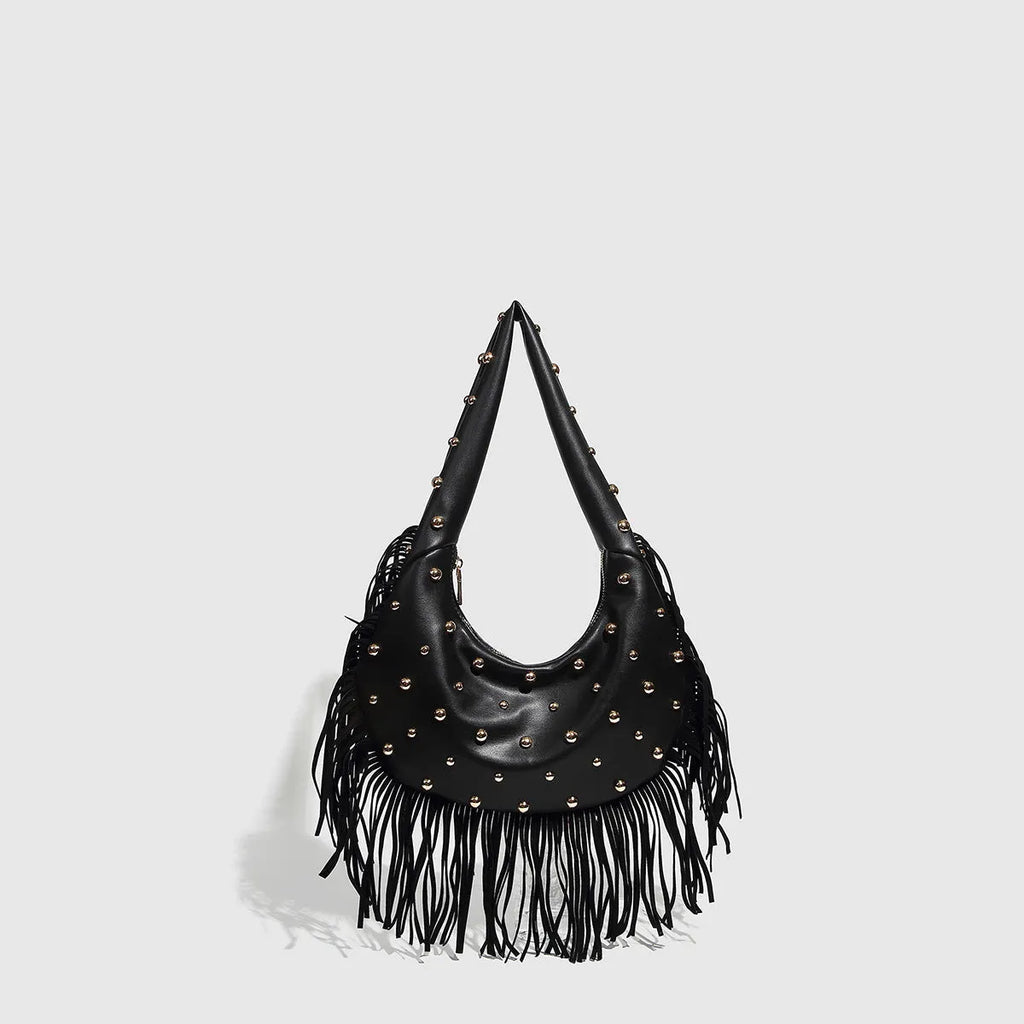 Retro black shoulder handbag with a long tassel decoration and an internal phone pocket.