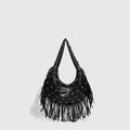 Retro black shoulder handbag with a long tassel decoration and an internal phone pocket.