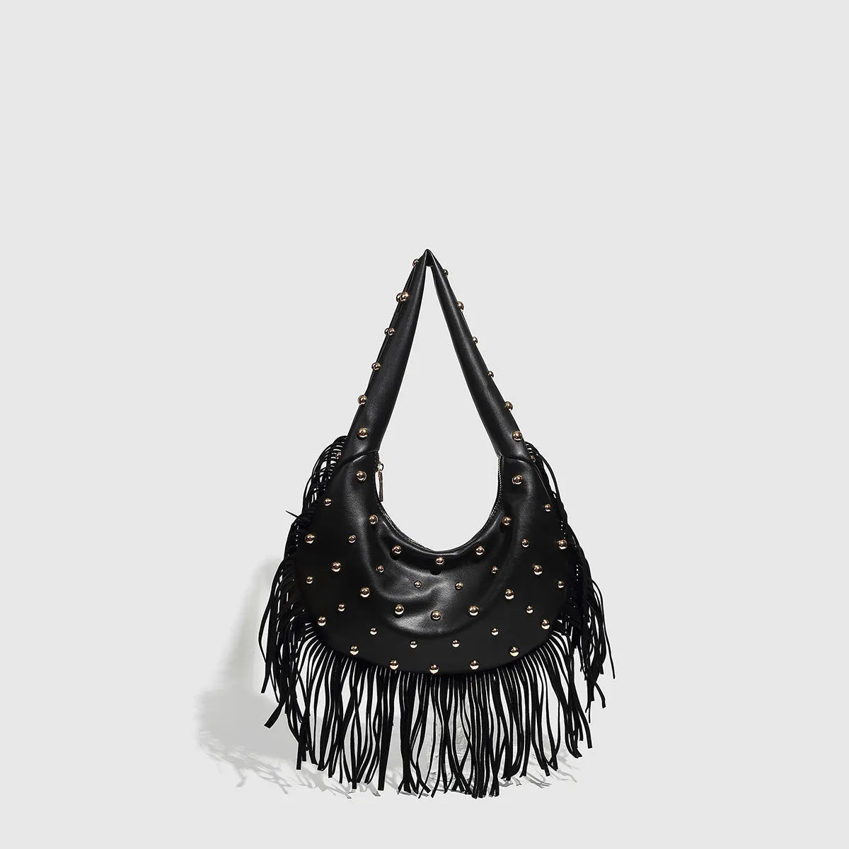 Retro black shoulder handbag with a long tassel decoration and an internal phone pocket.