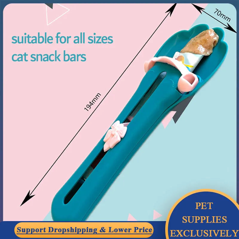 Green and pink plastic pet food scoop with squeeze mechanism for dispensing treats and liquid food