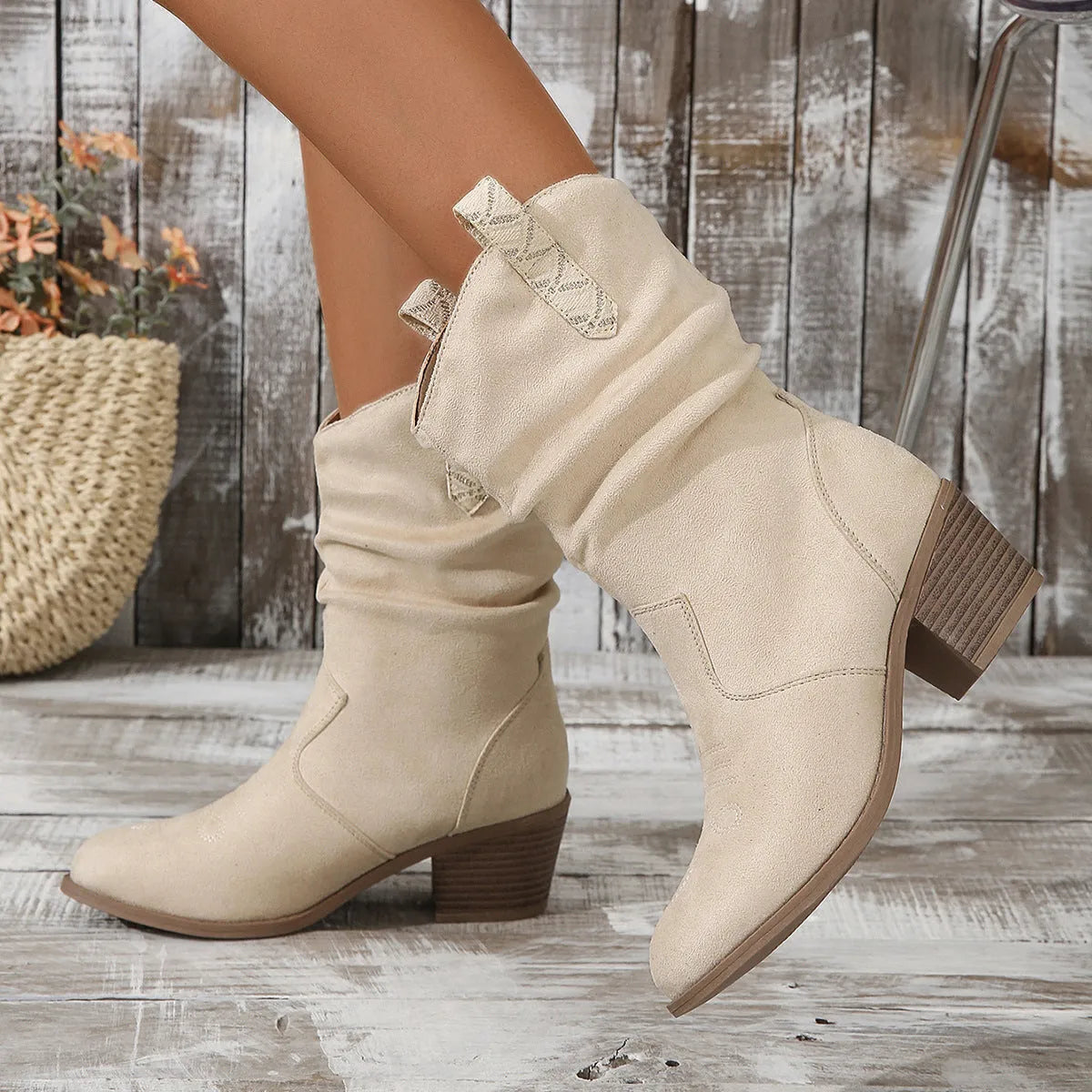Women's suede mid-heel calf boots in lotus root colour on a white background