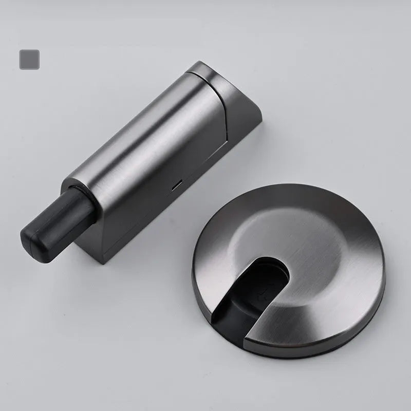 Modern invisible zinc alloy door stopper in six colour finishes on a wall.