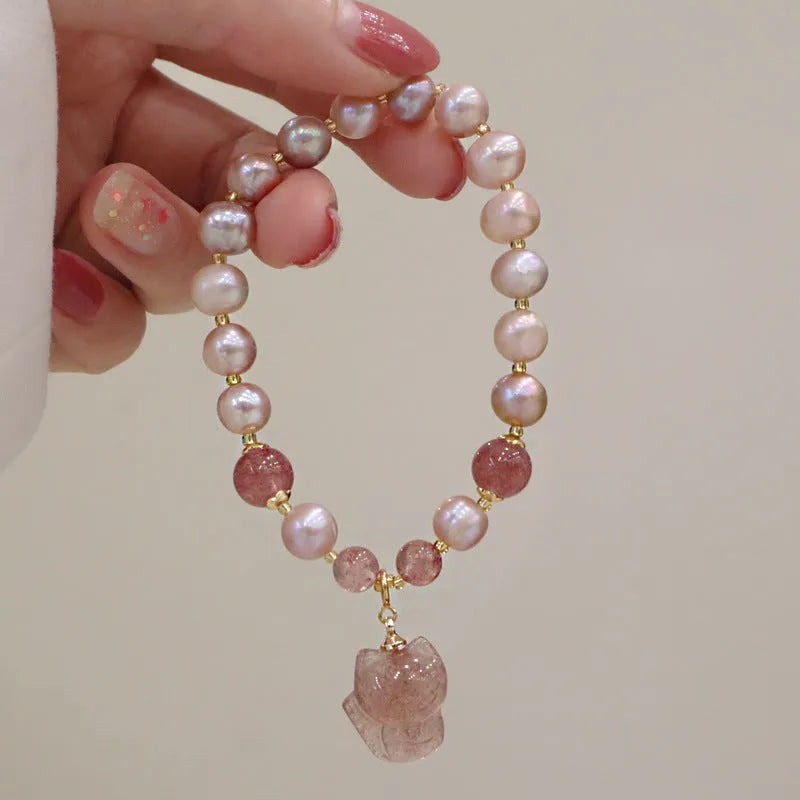 Women's natural freshwater pearl bracelet light pink colour with fox charm on wrist