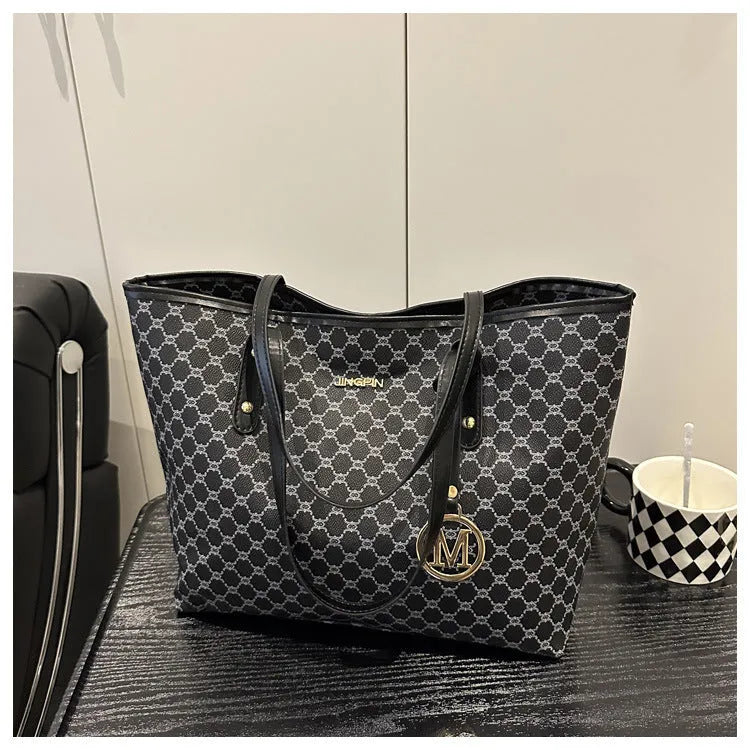 Western style PU leather shoulder bag showing sewing thread detailing, 42cm wide by 28cm tall, available in black, grey, white, and brown colours