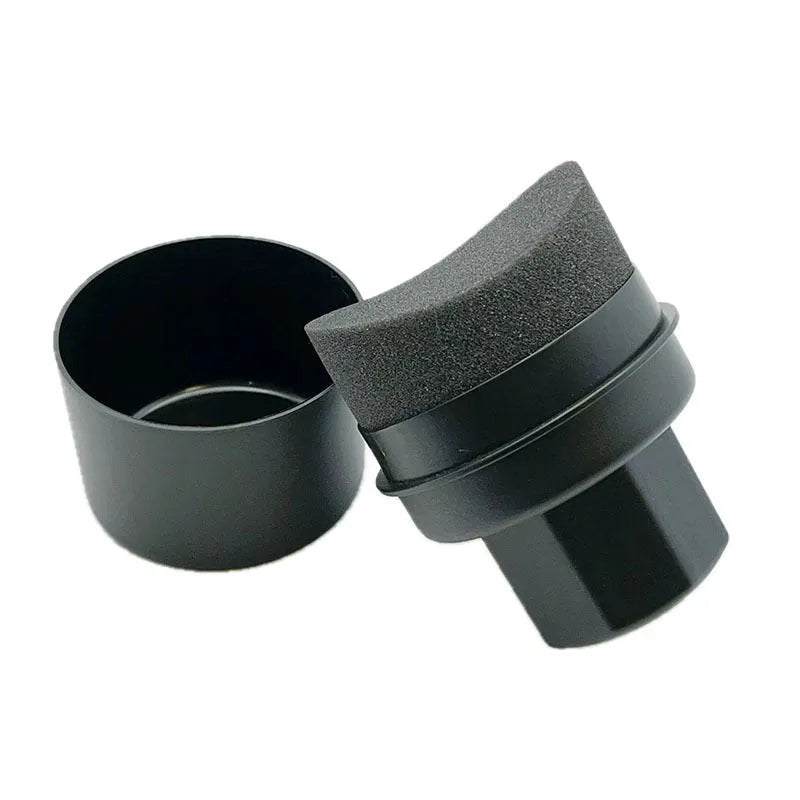 Black and red tyre polishing sponge brushes with lids on a surface, showing hand-held design and sponge options.