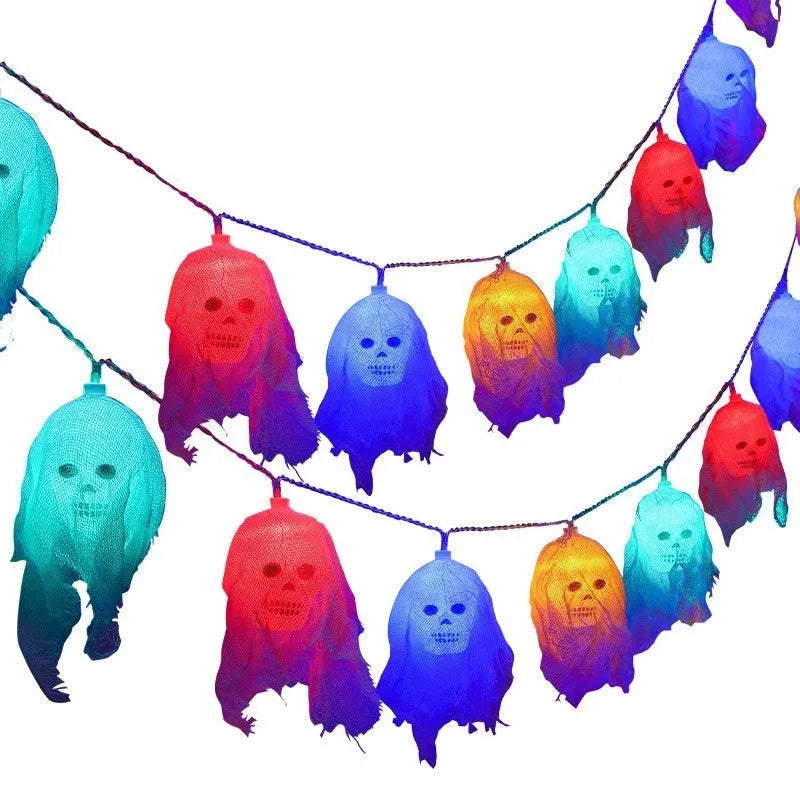 Halloween coloured LED string lights with battery box in 1.5m or 2.5m lengths on an indoor wall.