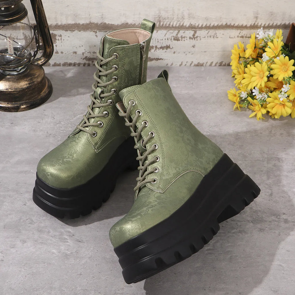 Women's black retro platform Martin boots with patchwork toe and side zip.
