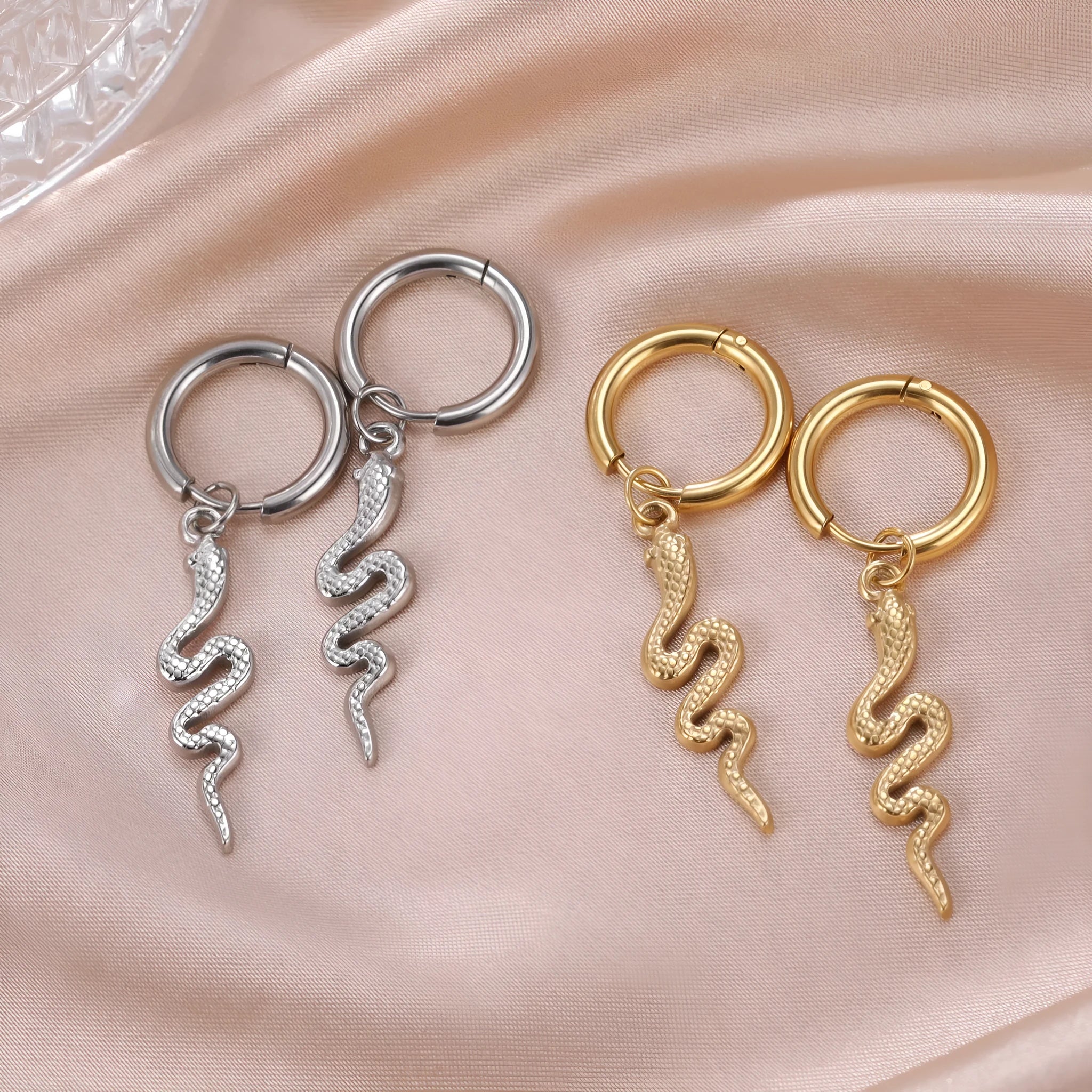 Gold plated stainless steel snake-shaped vintage clip earrings with Zodiac design