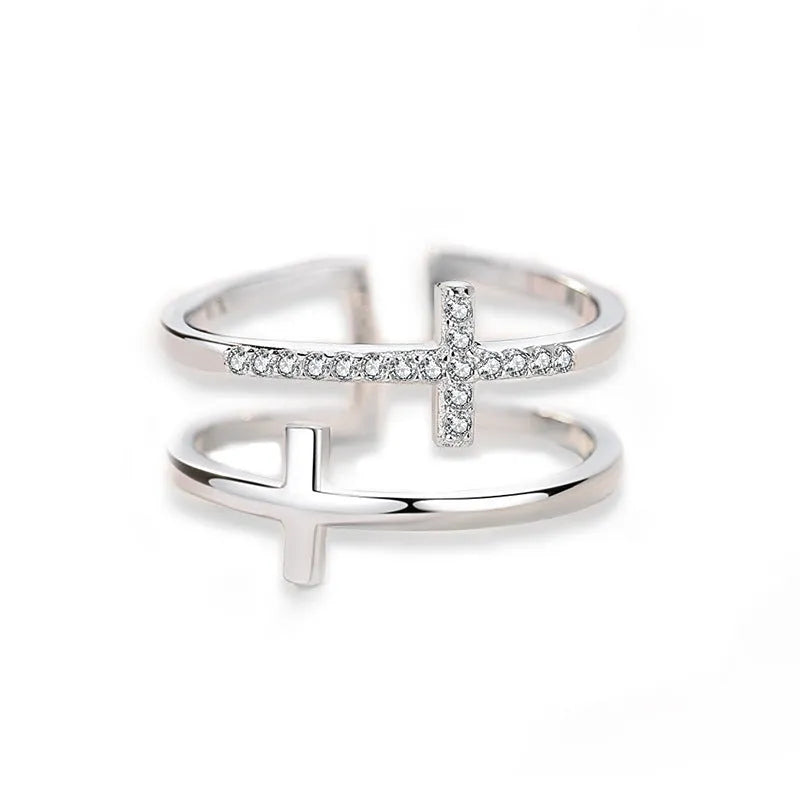 Adjustable copper ring with double cross design featuring zircon gems in sterling silver inlay, white gold colour