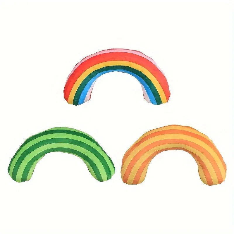 Green cat toy set containing a noise maker with catnip and a small striped pillow on a neutral background