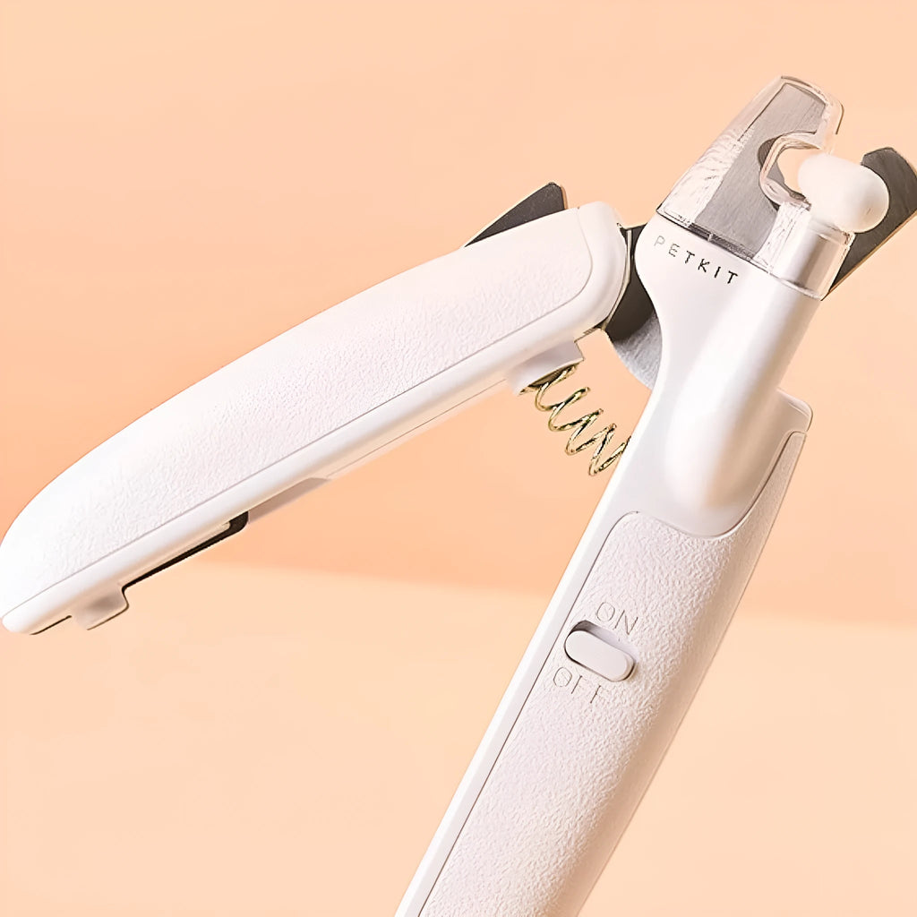 White pet nail clippers with LED light, transparent anti-splash baffle, and triangular steel blades for cats and dogs