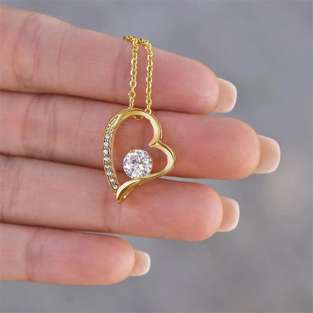 Hollow heart-shaped necklace in silver or gold colour with European and American style design.