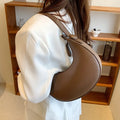 Women's retro dumpling shape shoulder bag in black with sandwich pocket design