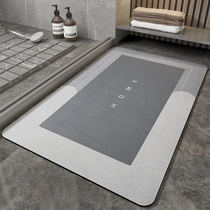Blue oval blended fabric bathroom floor mat on a tiled floor