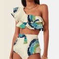 White women's one-shoulder swimsuit with large lotus leaf detail and side split.
