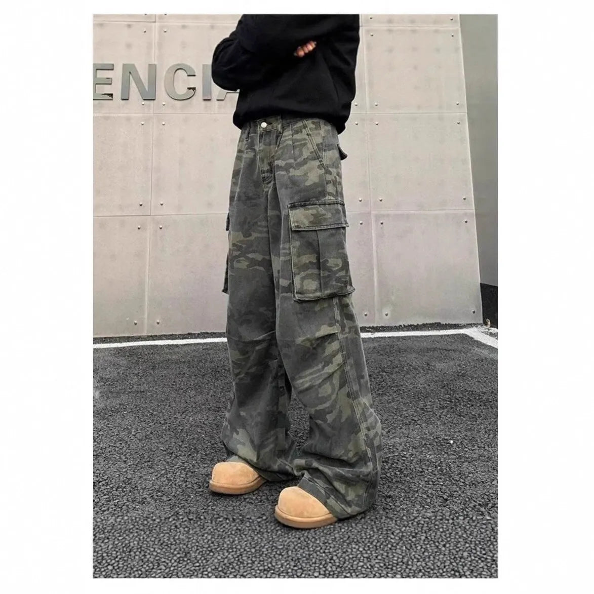 American vintage style washed camouflage cargo pants with multiple pockets on a mid-waist, full-length silhouette.