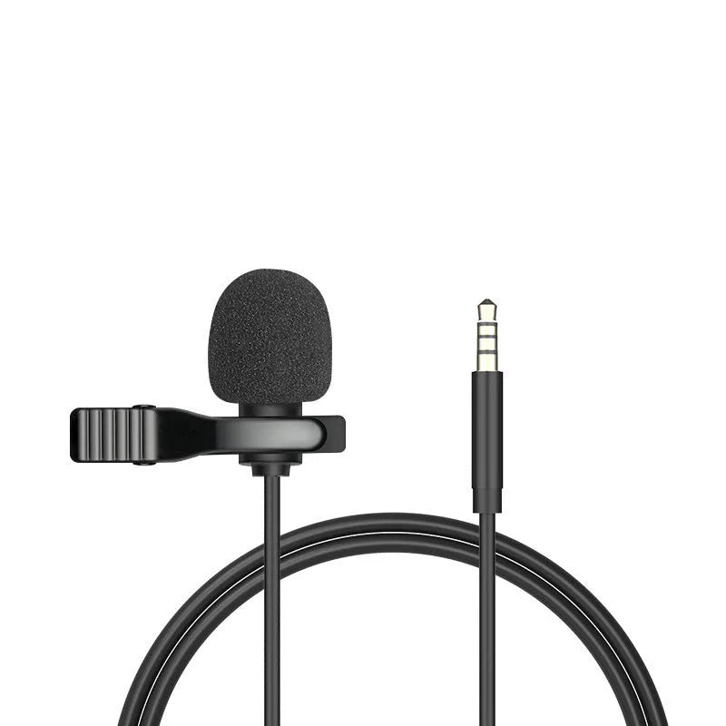 White lavalier lapel clip microphone with long cable and in-ear earpieces next to an iPhone.