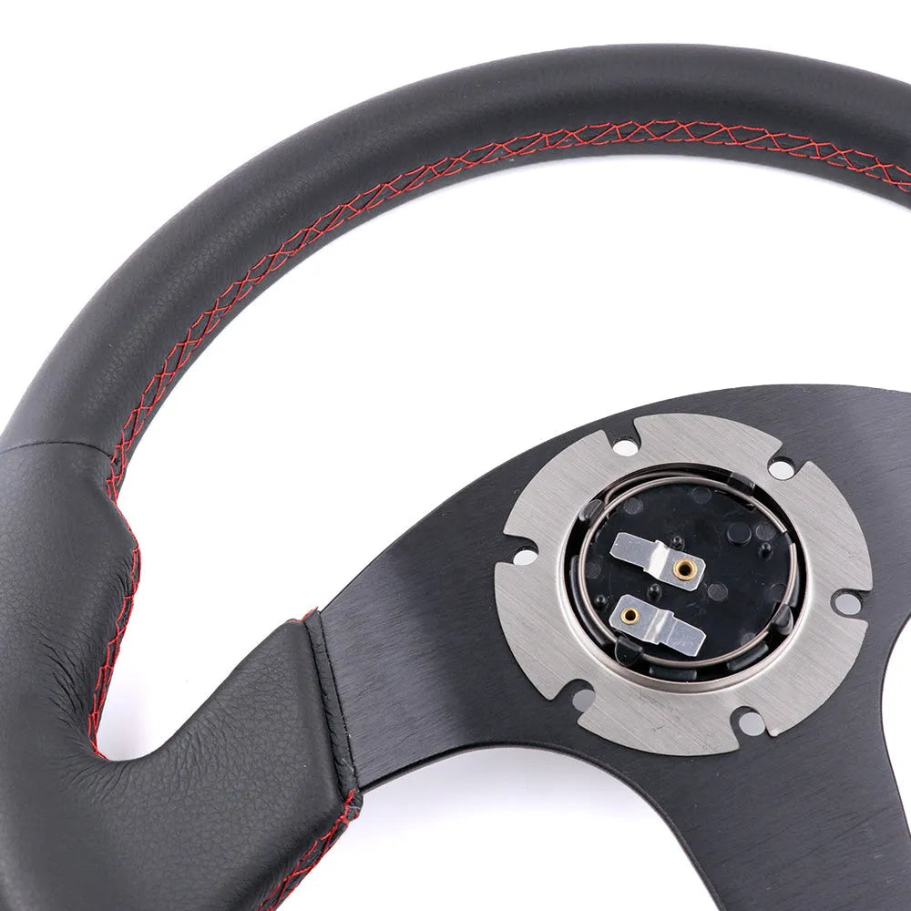 13 inch BRIDE microfiber leather flat steering wheel on black bracket with screw holes visible