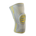 Cotton mountaineering knee pads in green, blue and yellow colours showing knee protection design