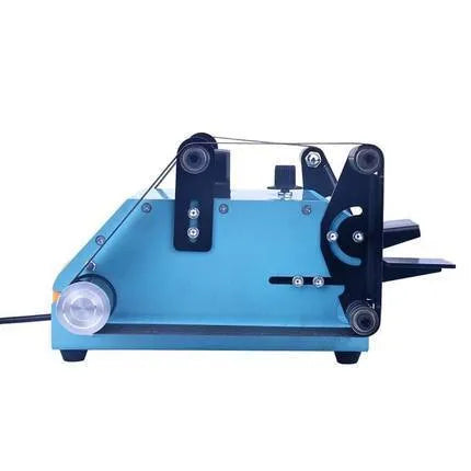 Blue desktop dual-axis belt sander and knife sharpening tool on a workbench.
