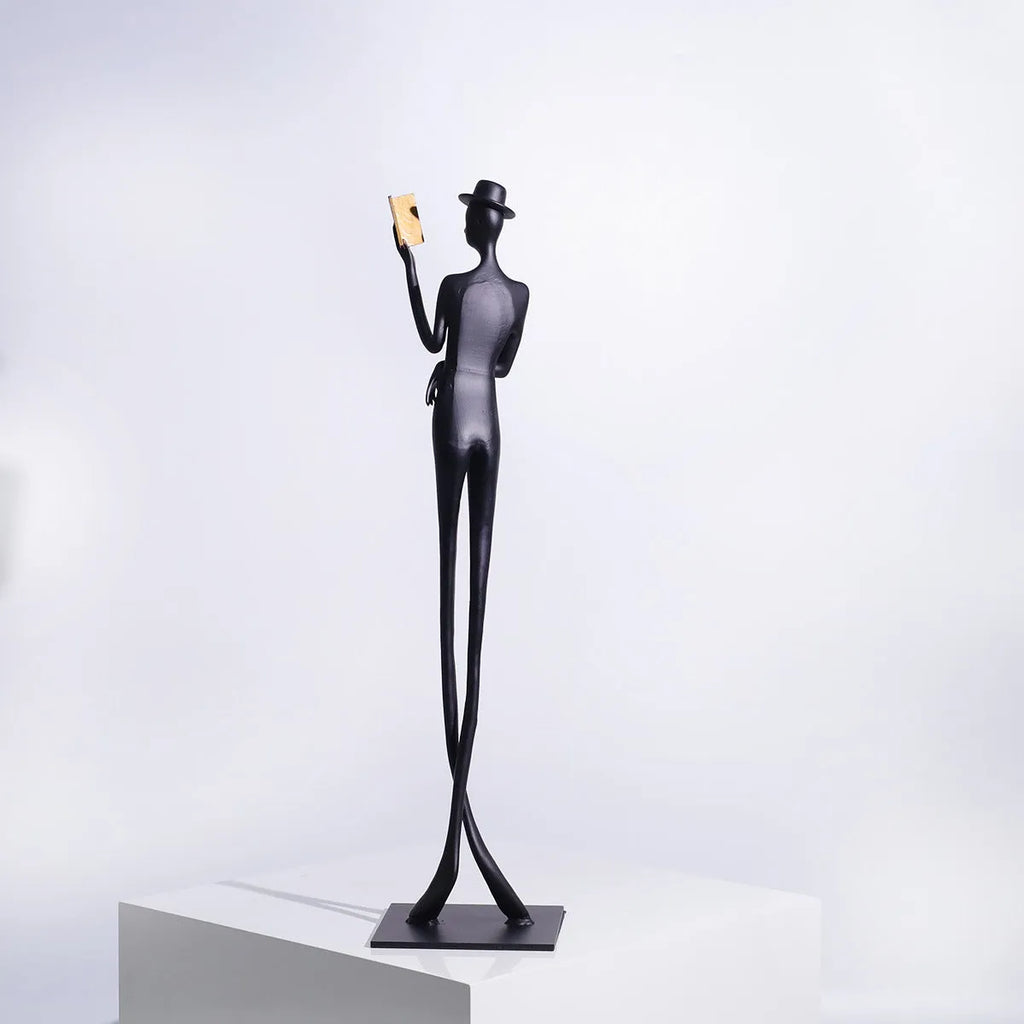 Black metal cast aluminium desktop sculpture with modern minimalist character figure design