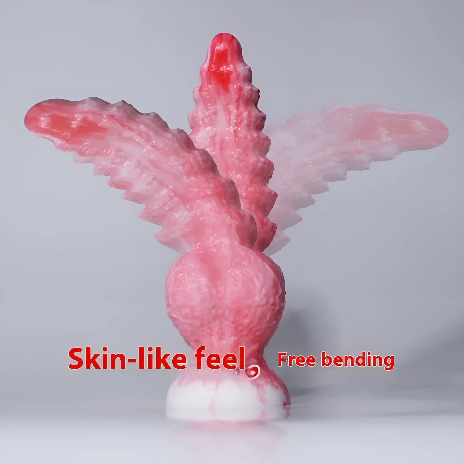 Pink platinum silicone shaped penis women's masturbation device on a plain background.