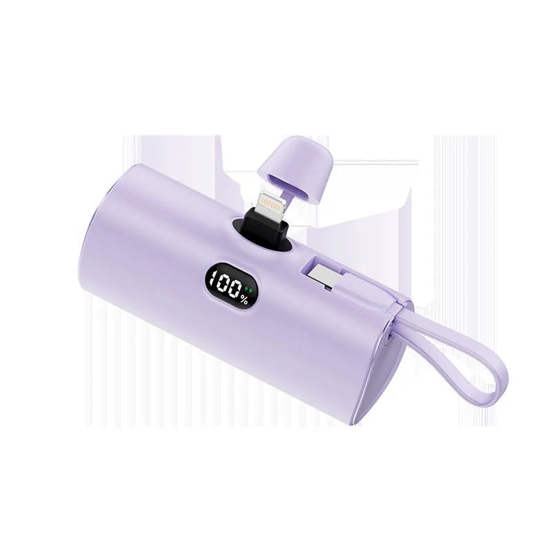 Capsule-shaped wireless power bank with digital display showing battery percentage
